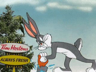 Bugs Bunny using a hand wood saw to separate Canada from USA.