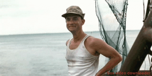 Tom Hanks as Forest Gump, waving at the camera.