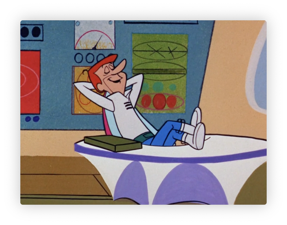 This image depicts an animated character relaxing in a chair with a whimsical, futuristic design, indicative of mid-20th-century modern animation. The character is smiling and has a relaxed posture with his hands behind his head, and his feet on the desk. He is dressed in a futuristic outfit, wearing a white shirt, blue pants, and white shoes with straps. The setting appears to be a control room or a cockpit, featuring various colorful panels and dials in a stylized format with vibrant colors, contributing a retro-futuristic look typical of some popular animated shows from the 1960s.

What a slacker.