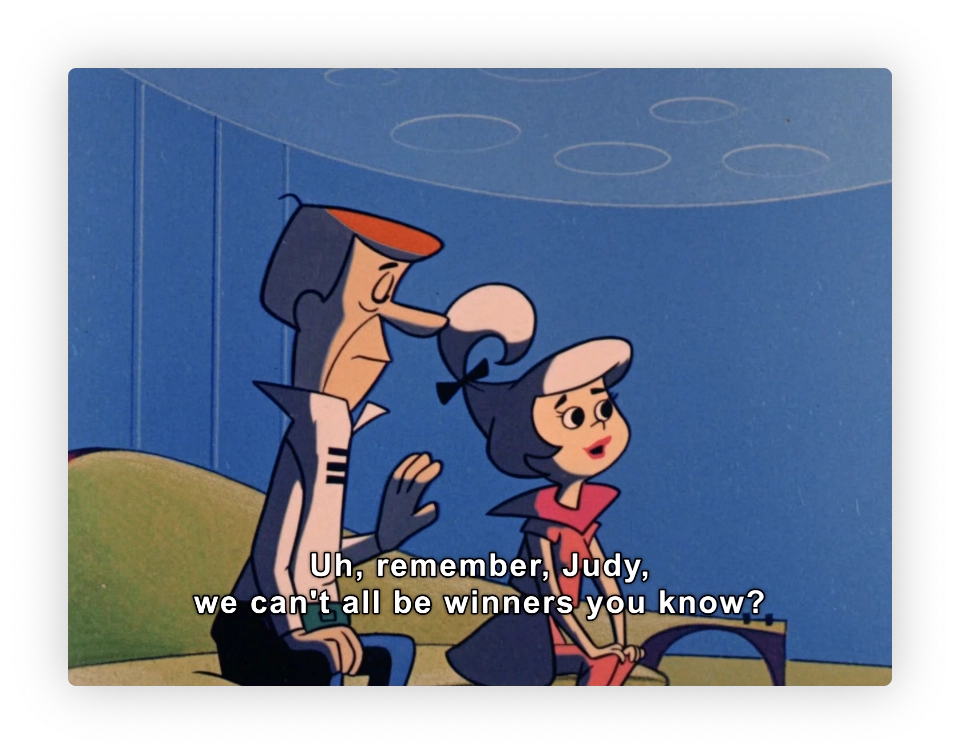 This image features two animated characters. The male character, dressed in a white uniform, appears to be comforting the female character, Judy, who is wearing a shirt with a Peter Pan collar and a hair bow. There is text at the bottom of the image that reads, "Uh, remember, Judy, we can't all be winners you know?" which suggests that the male character is giving some sort of reassurance or advice to Judy, likely about a competition or event they were involved in. The style of the animation and characters resembles classic mid-20th century American cartoons.