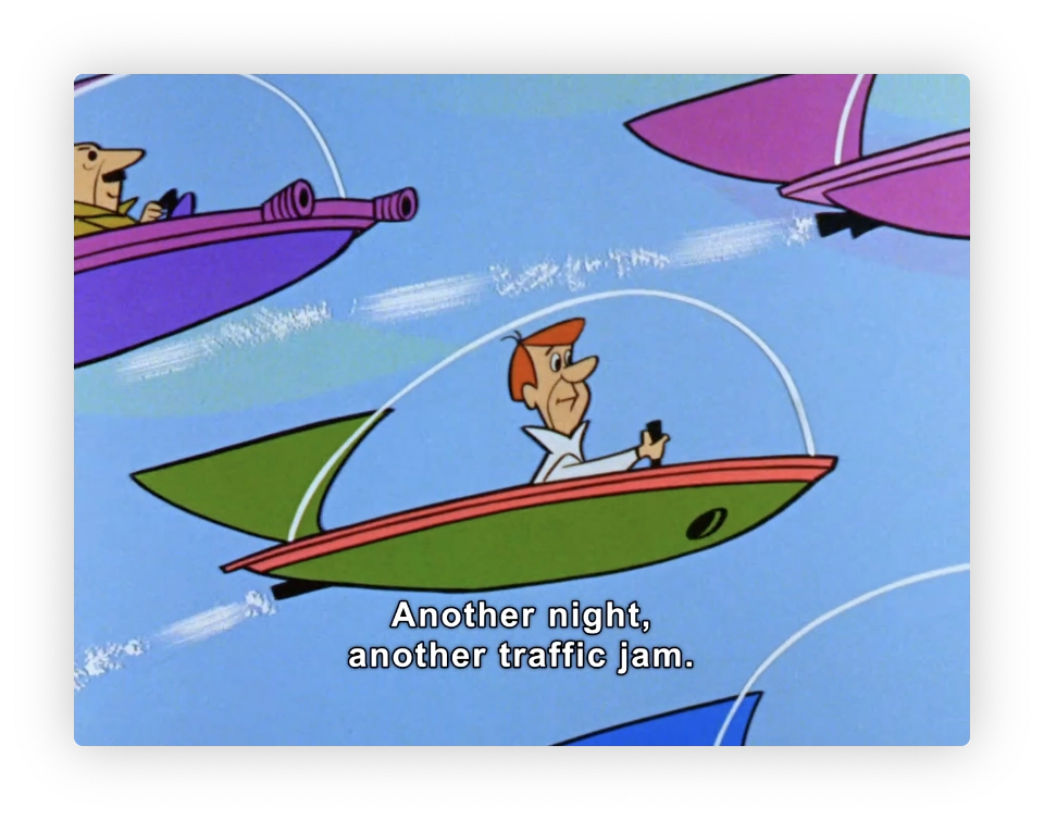 The image shows a scene from a classic animated television series. It features three futuristic flying cars, each with a single occupant, caught in a traffic jam. The cars resemble rocket-shaped pods and are variously colored in purple, green, and red. Each pod has a transparent bubble canopy. The central character, a man in the green and red car, seems exasperated or resigned, indicating his reaction to the traffic jam. The caption "Another night, another traffic jam." is displayed at the bottom, suggesting a commonplace or recurring situation in the setting of the show.