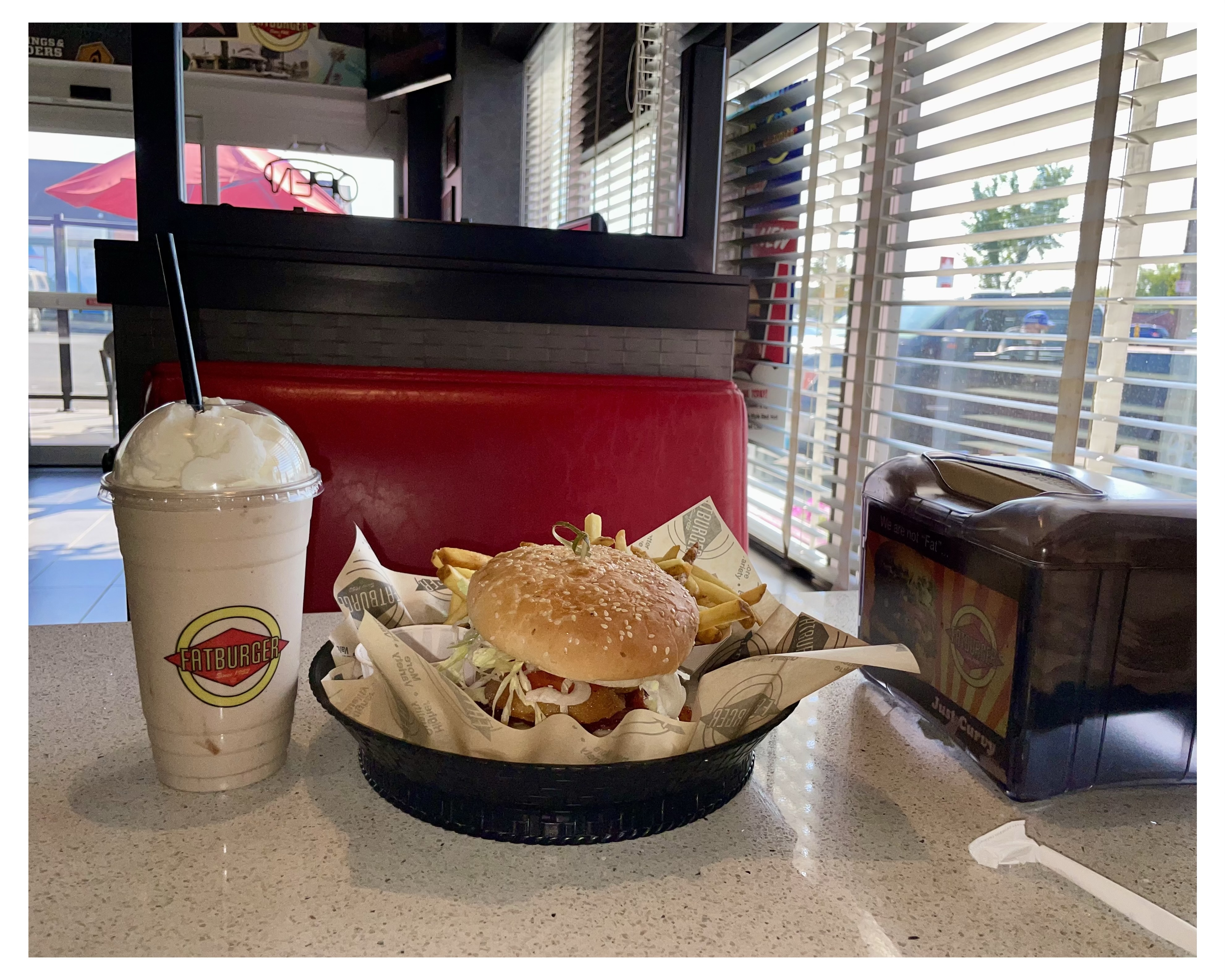 Fat Burger booth with shake, fries, burger freshly made