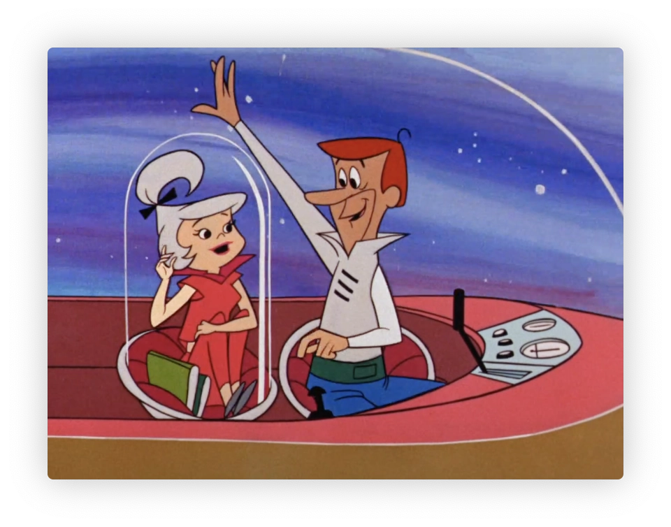 This image shows two animated characters from the classic television show "The Jetsons." The male character, George Jetson, is seated on the right, holding a steering mechanism, and appears to be happily waving. The female character, his daughter, Judy Jetson, is seated on the left in a clear, dome-shaped enclosure that could be part of a futuristic vehicle, typical of the show's setting. Both characters are depicted in a stylized retro-futuristic environment, indicative of the show's imaginative depiction of a space-age family.