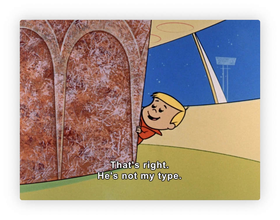 This image is from an animated show, featuring a character peeping from behind what appears to be a futuristic or modernly designed structure with two arches. The setting suggests a blend of indoor and outdoor elements, given the presence of a wall mixed with a view that includes a visible lamppost and sky outside. The cartoon character, a smiling young boy with blond hair, is shown making a statement: "That’s right. He's not my type." This piece of dialogue hints at a humorous or lighthearted context within the storyline.