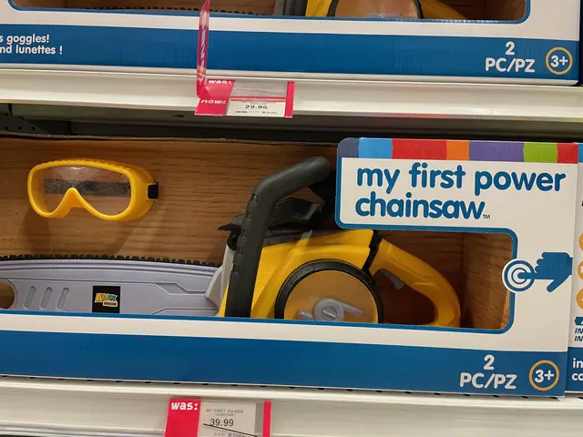 Quick and dirty phone camera picture of a shelf in a toy store, featuring "My first power chainsaw"