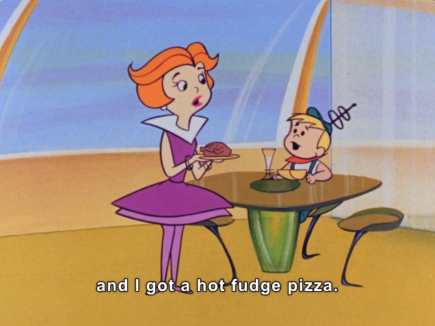 In this vibrant animated scene, we see a character with bright orange hair styled in a dramatic bob, wearing a stylish purple dress with a wide collar. She stands at a sleek, modern table that features a green, curved design. In her hand, she holds a plate with a small roast bird. Seated across from her is a young boy with a circular, cheerful face, dressed in a blue shirt and green cap. He looks up with excitement as he interacts with the woman, capturing a playful and lighthearted atmosphere typical of family-friendly animated shows. The background features futuristic, curved architectural elements, adding to the show's imaginative setting. The dialogue highlights the playful context of their conversation.

Elroy: "and I got a hot fudge pizza"

#Nutrition #BreakfastOfChampions
