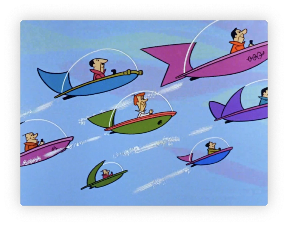 This image features a scene with several cartoon characters flying in small, colorful flying cars. Each car has a streamlined, futuristic design, with a clear bubble canopy over the cockpit where a single cartoon character pilots the vehicle. The cars vary in color and design and are depicted at different altitudes and angles, giving a dynamic sense of movement. The background is a simple blue sky with white lines indicating motion. This style is reminiscent of mid-20th century animation, commonly associated with classic futuristic cartoons like "The Jetsons."