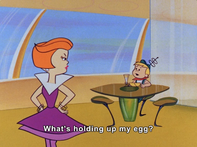 In this vibrant and colorful animated scene, two characters engage in a humorous exchange inside a futuristic dining space. The woman, depicted with striking red hair and a fashionable purple dress featuring a bold white collar, stands with her hands on her hips, conveying impatience or frustration. She looks directly at the other character, who is seated at a sleek, modern table. 

This character, a young boy with a distinctive green cap and antenna-like accessories, is focused on a glass in front of him, seemingly lost in thought. The interior design features large, panoramic windows that allow natural light to flood the space, enhancing the bright color palette. The bold, cartoonish style evokes a playful, whimsical atmosphere, with the dialogue bubble displaying the line, "What's holding up my egg?" suggesting a lighthearted moment. 

#Manners #GetYourOwnBreakfast #MommysTired